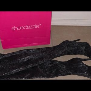 Heeled thigh high snake skin boots